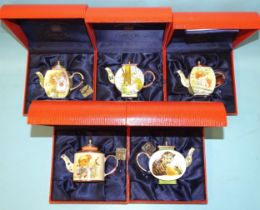 A collection of five Charlotte di Vita Trade Plus Aid Beatrix Potter themed enamel teapots, (all
