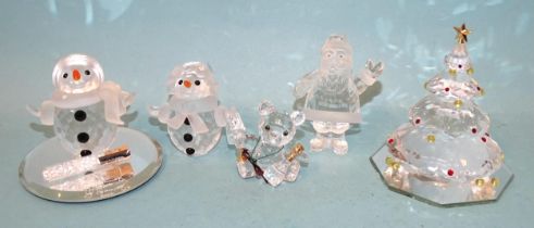 Swarovski Crystal Society, a collection of five small crystal sculptures: Snowman, Snowwoman, Father