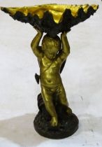 A gilt and bronze tazza in the form of a winged cherub supporting a clam shell, on circular base,