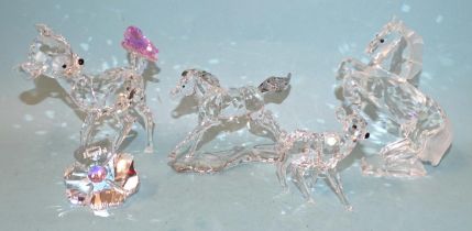 Swarovski, a collection of four crystal sculptures: White Stallion, Foal, Fawn and Bambi with