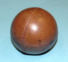 A vintage leather cricket ball novelty inkwell, the hinged top opening to reveal a plated dome top