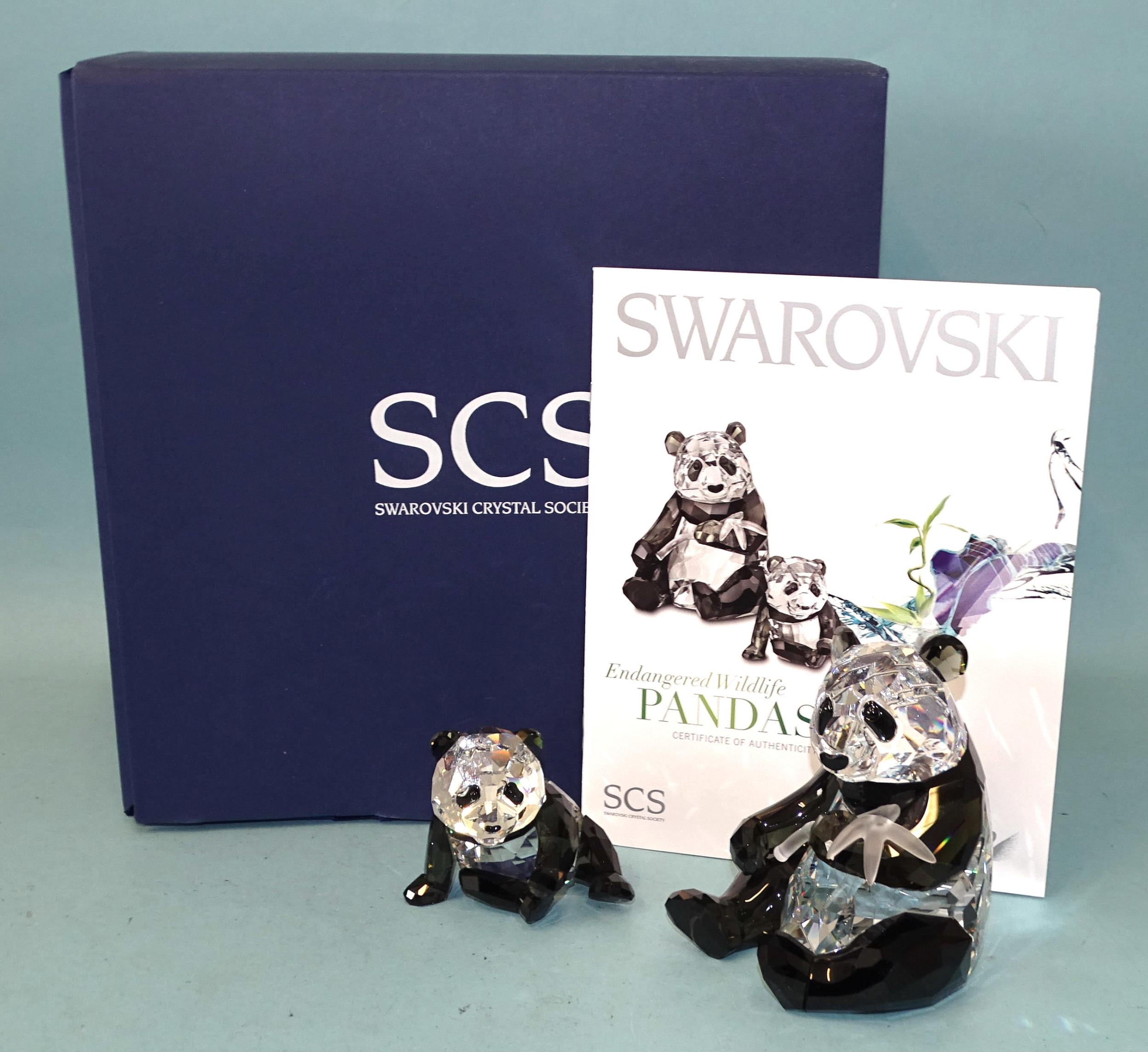 Swarovski Crystal Society Endangered Wildlife crystal sculpture, Pandas, together with another,