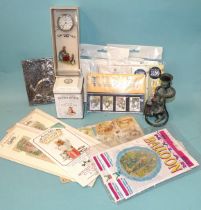 A collection of modern Beatrix Potter memorabilia, including lapel badge, Royal Mint three Peter