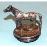 A small plated car mascot in the form of a horse, 7.5cm high, base 6cm diameter.