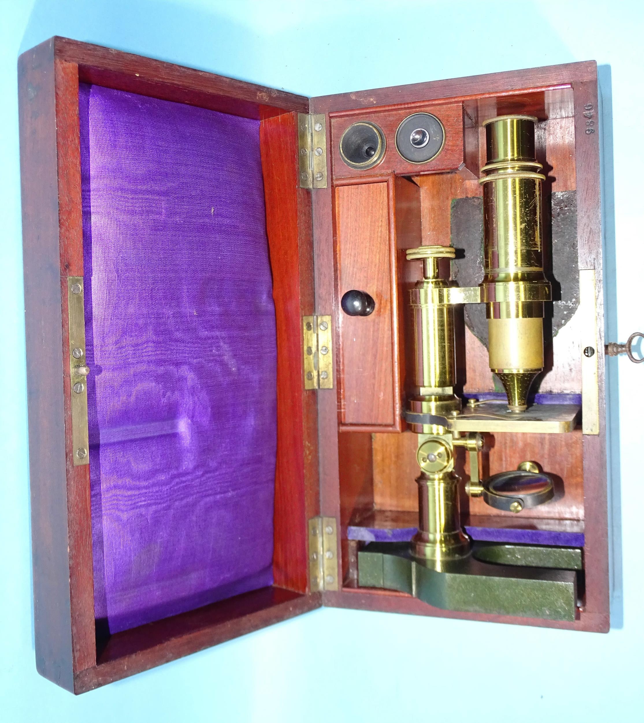 A brass lacquered unnamed microscope on metal Y-shaped base, 25cm high, in fitted mahogany box. - Image 2 of 2