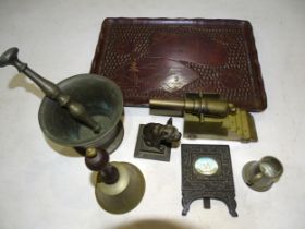 A 'trench art' bronze canon on brass truck, a bronze pestle and mortar and other items.