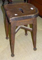 An oak and elm rustic stool with shaped solid seat, another labelled, Gaskell & Chambers Ltd, Dale
