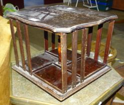 A miniature mahogany revolving book case with metal label, Goodyears, Regent & Bond Street,