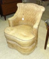 An early 20th century upholstered low tub armchair.