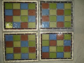 A collection of four leaded-light windows, each with sixteen blue, red, yellow and green 9.5 8cm