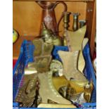 A collection of brass mantle boot ornaments, a J S & S copper Art Nouveau jug and other brassware.