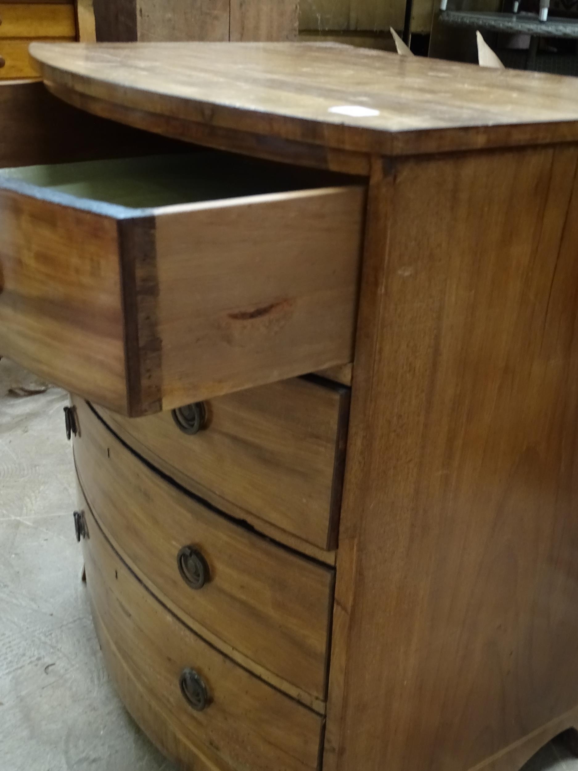 A mahogany bow-fronted chest of four small drawers, on bracket feet, 63cm wide, 72cm high and a - Bild 2 aus 2