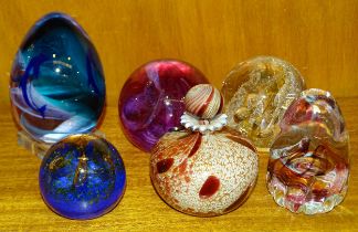 A Caithness "Fiesta" globe paperweight and other Caithness and Selkirk paperweights, (6).