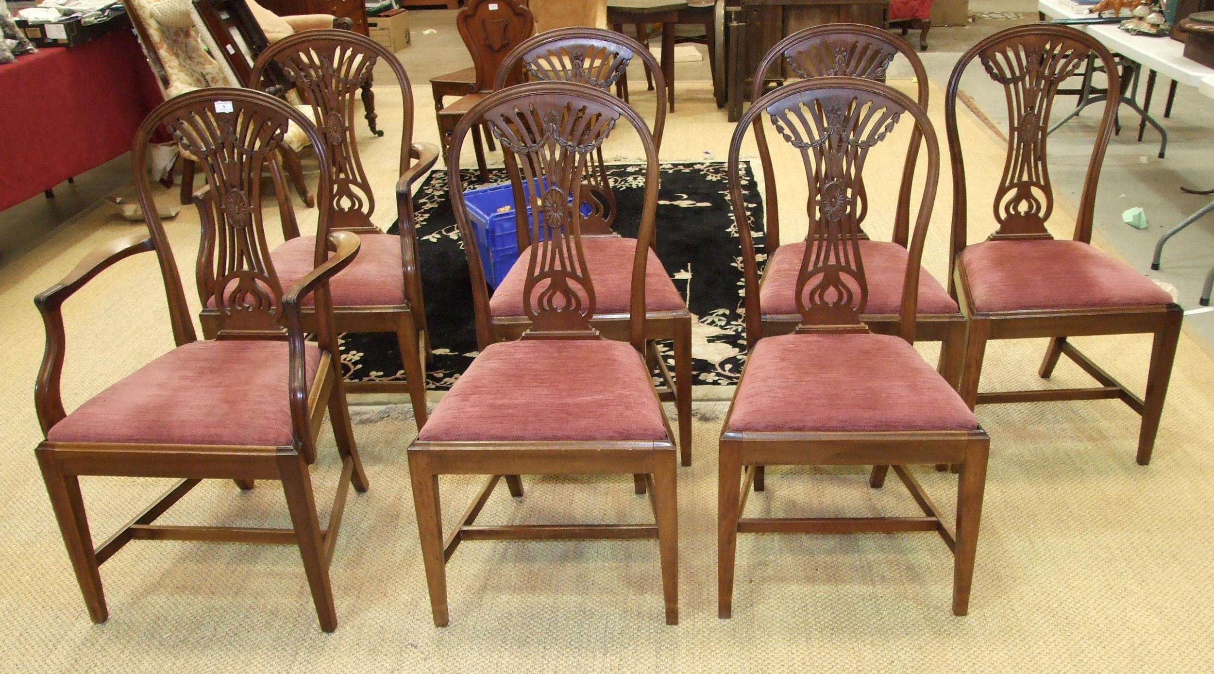 Seven reproduction Hepplewhite-style dining chairs, together with a Regency-style twin-pillar dining