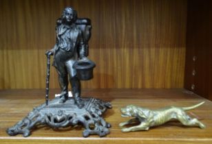 A metal figure of a gentleman of the road, 15cm high, a brass model of a running hound, a plated