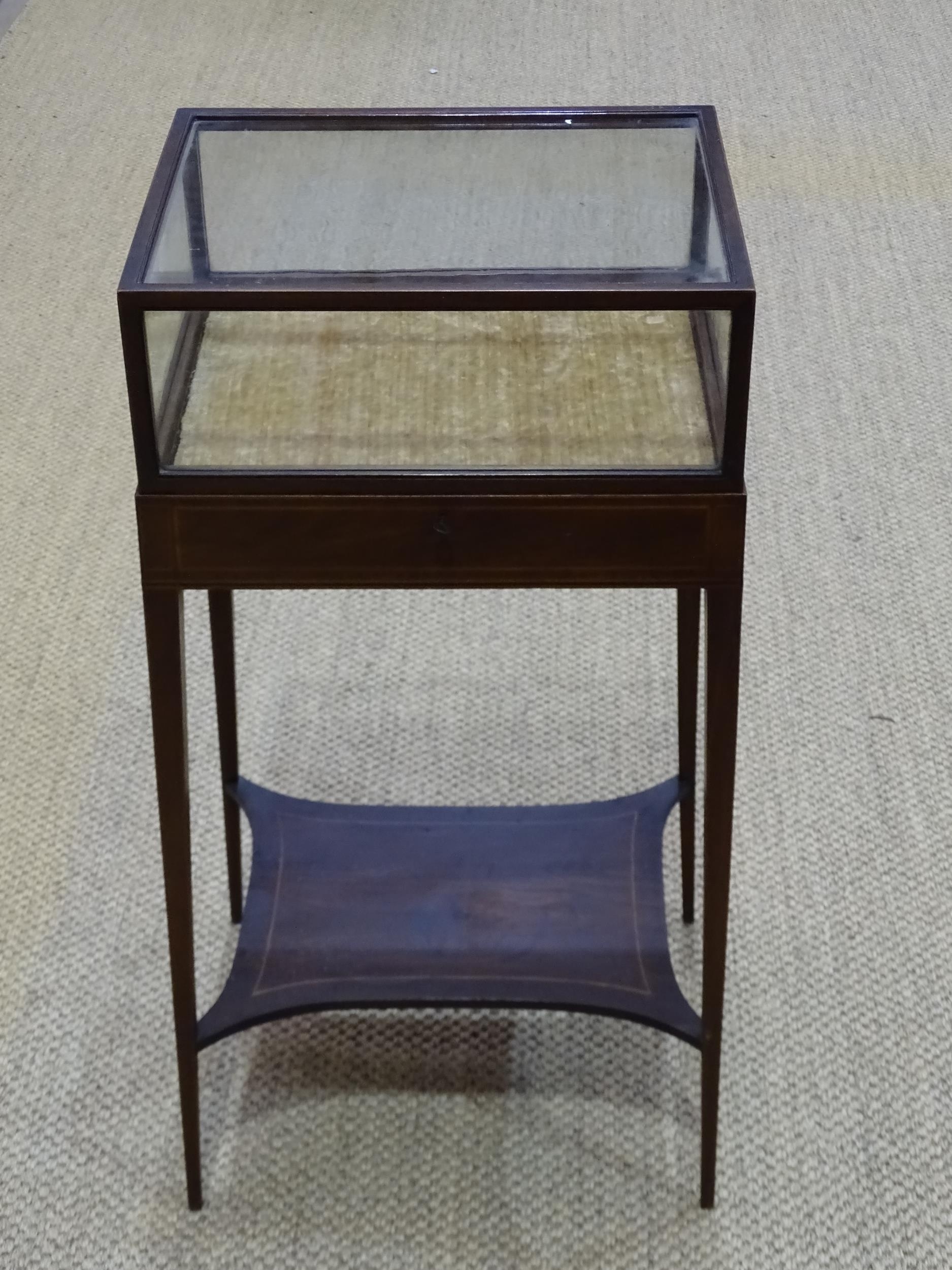 An Edwardian inlaid mahogany display stand, the glazed top on square tapered legs united by an - Image 2 of 2