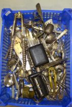 A large pair of plated nutcrackers, various plated cutlery, grape scissors and other items.