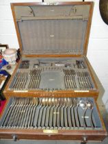A part-canteen of plated cutlery, in fitted wood box.