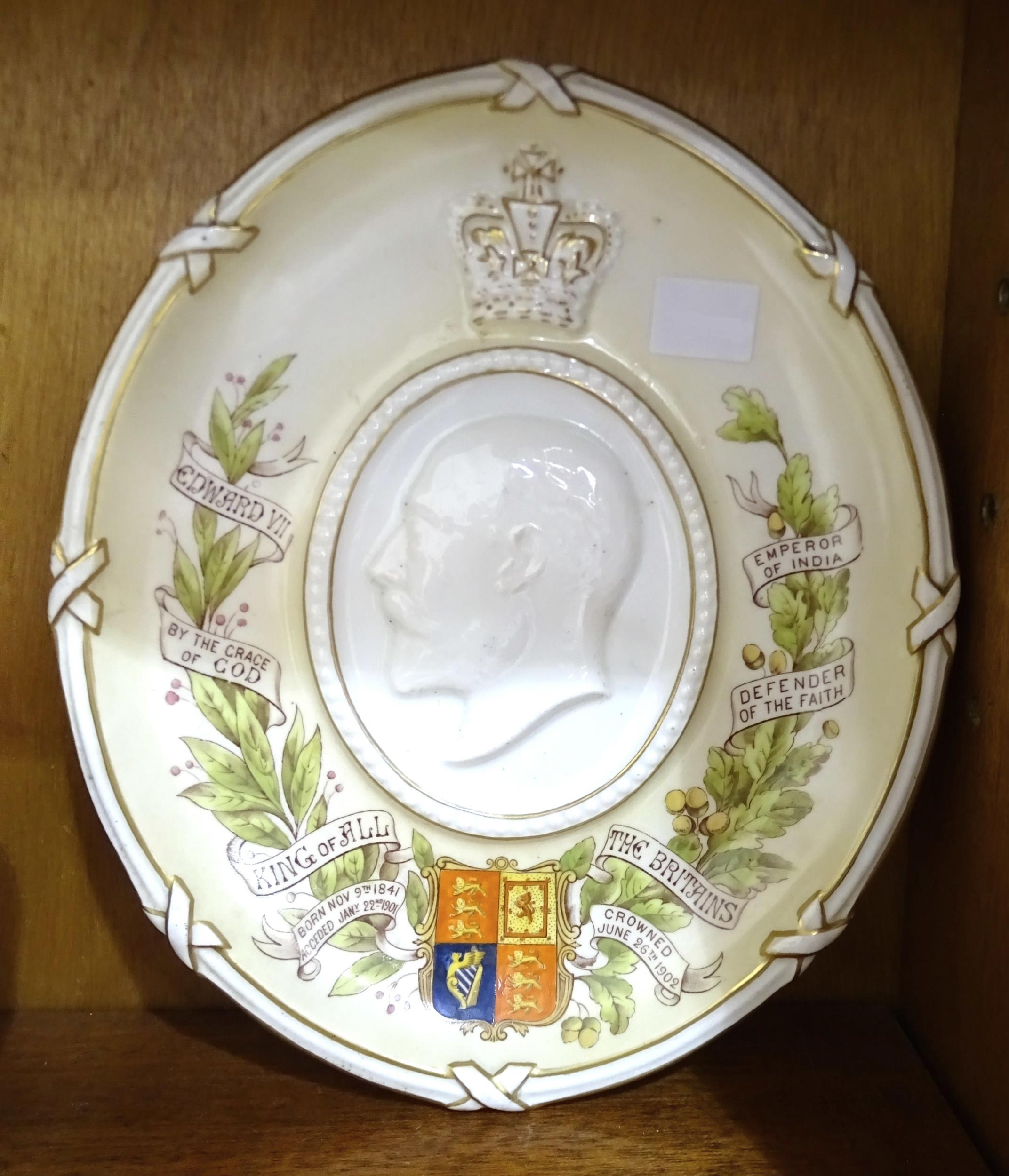 An oval commemorative plaque depicting Edward VII, 26 x 22cm, a Queen Victoria jubilee ring, a
