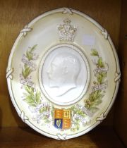 An oval commemorative plaque depicting Edward VII, 26 x 22cm, a Queen Victoria jubilee ring, a