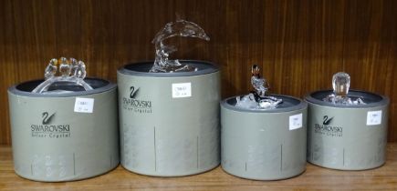 A collection of four boxed Swarovski crystal glass animal figures, comprising: four baby