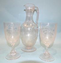 An etched glass wine jug decorated with ferns, leaves and a monogram "RFL"?, 28cm high and two
