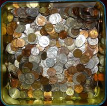 A large collection of British, USA and other foreign coinage, the contents of two tins.