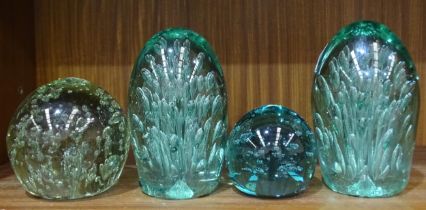 Two glass dump paperweights of dome shape, 14cm high and two smaller glass dump paperweights, (4).