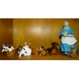 A Royal Doulton figure "The Favourite" HN2249, other Royal Doulton figures of dogs and cats and a