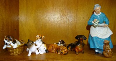 A Royal Doulton figure "The Favourite" HN2249, other Royal Doulton figures of dogs and cats and a