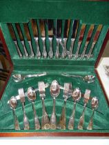 A modern canteen of fiddle, thread and shell pattern cutlery, eight-piece setting including