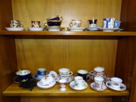 A collection of mainly 20th century cabinet cups and saucers, including Royal Crown Derby, late