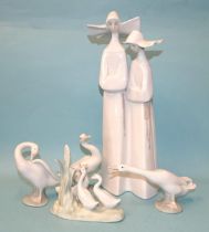 Lladro, a figurine depicting two nuns in habits, Lladro back stamp and impressed marks to base, 34cm