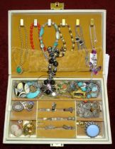 A quantity of costume jewellery in a large jewellery box.