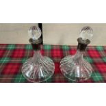 2 SILVER COLLARED DECANTERS (1 STOPPER HAS SMALL CHIP-AF)