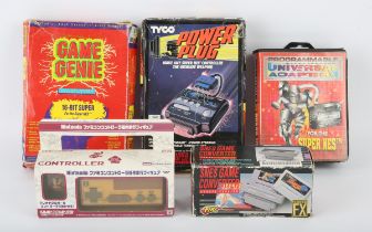 An assortment of accessories for the Super Nintendo (SNES) Includes: Family Computer Goomba