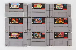 An assortment of loose NTSC Super Nintendo (SNES) cartridges (x9) Highlights include: Art of