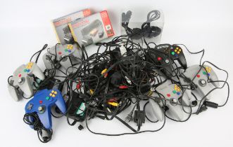 A large assortment of Nintendo 64 (N64) cables, plugs, accessories (both first and third party)