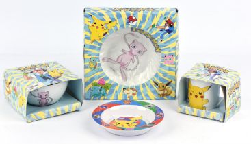 Assortment of Pokemon bowls and mug merchandise, most in original boxes.