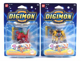 Two original Bandai boxed Digimon Figures featuring the popular WarGreymon and Tyrannomon.