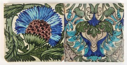 William De Morgan, (British, 1839-1917). Two Islamic flower tiles, impressed Merton Abbey marks to