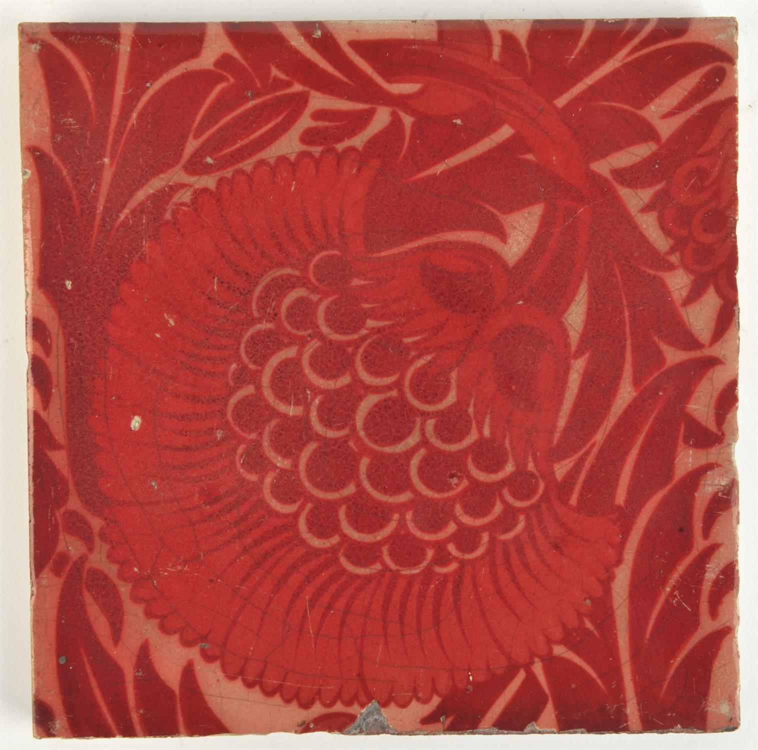 William De Morgan, (British, 1839-1917), a tile decorated with a flower, red lustre,