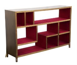 Julian Chichester, Henri bookcase, aged brass and red felt, 85cm high x 130.5cm wide x 33cm deep