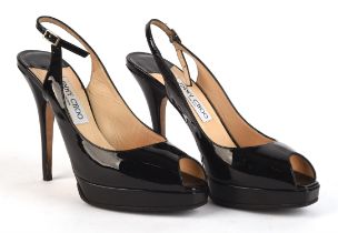 JIMMY CHOO pair boxed black patent leather sling back stiletto heeled shoes with dust bag.