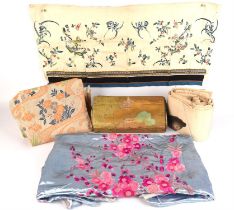 A collection of vintage Chinese and Japanese silks, panels and and fabrics to include a gold