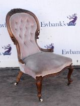 A Victorian walnut spoon back occasional chair, with buttoned back and cabriole legs with castors