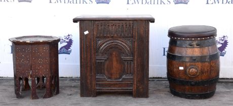 A Charles II style oak wine cooler, with arched panel front and sides, the lid hinged,