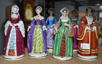 A set of six German porcelain figures, of the wives of Henry VIII, all named to the rear of their