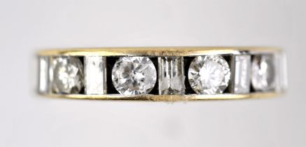 Diamond half eternity ring, with alternating round brilliant cut and baguette cut diamonds weighing