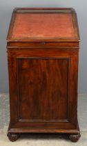 A William IV mahogany davenport, 1830s, the leather inset sliding top above a lateral slide,